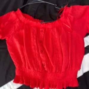 Super cute red top with buttons.